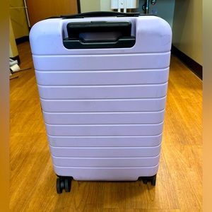 AWAY light purple bigger carry on suitcase expandable
